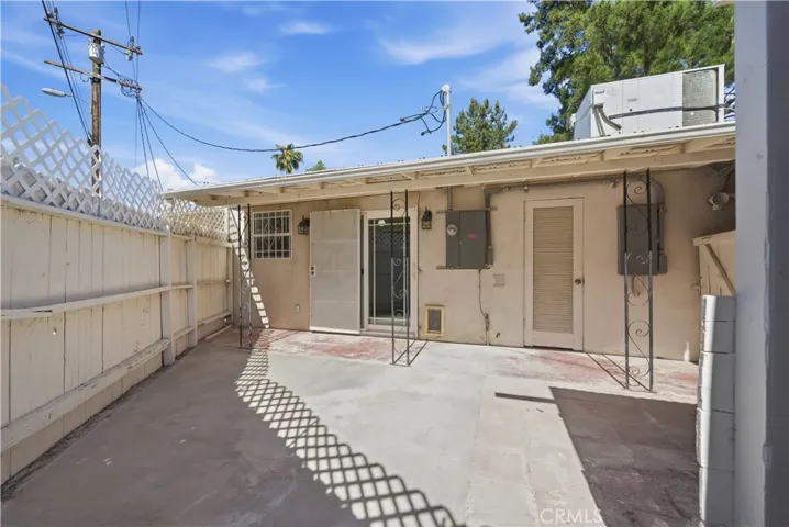 Rear view of home at back patio area