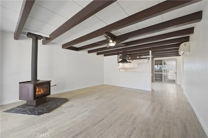 Reverse angle of living room w kitchen in the background