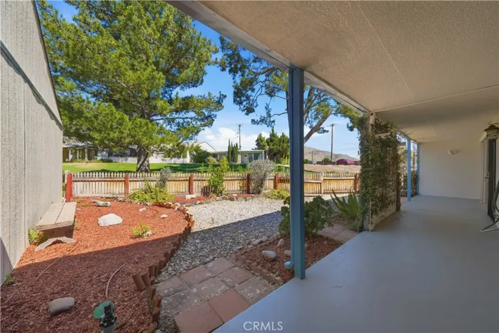 Covered front porch and low maintenance front yard