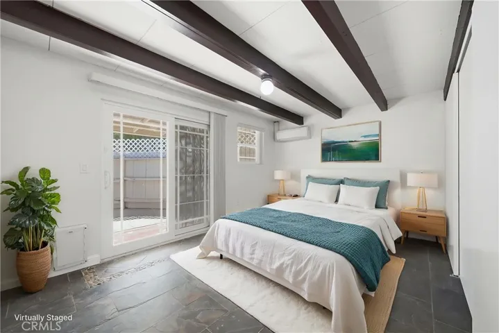 Bedroom 2 w digitally enhanced virtual staging.