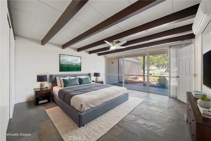 Front bedroom w digitally enhanced virtual staging.