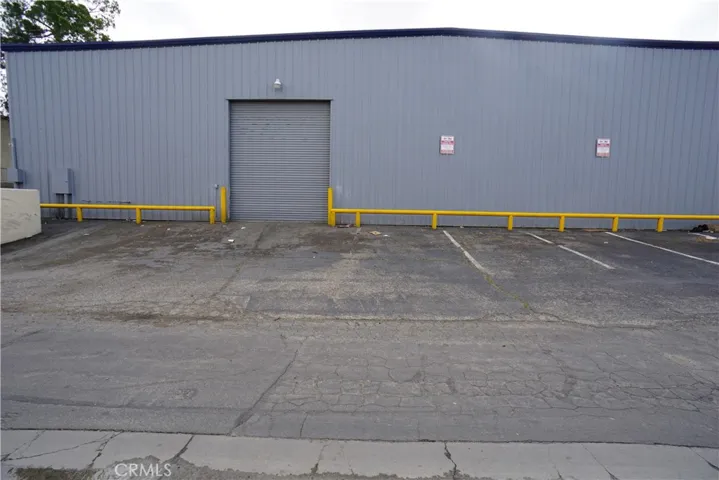 Back view of Unit "A" showing the Roll up door & additional parking.