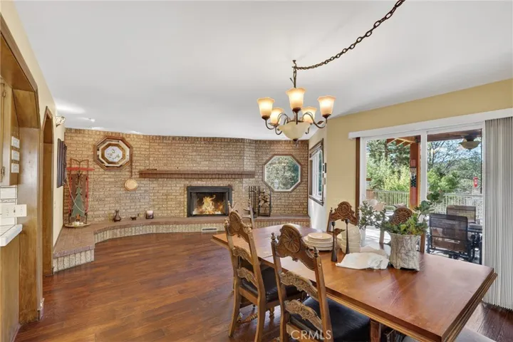 Brick fireplace in dining area.