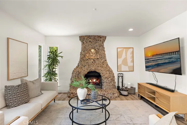 Den with wood burning/gas fireplace