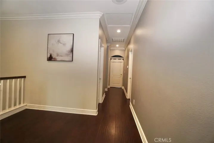 HALLWAY TO BEDROOMS WITH CROWN MOLDING
