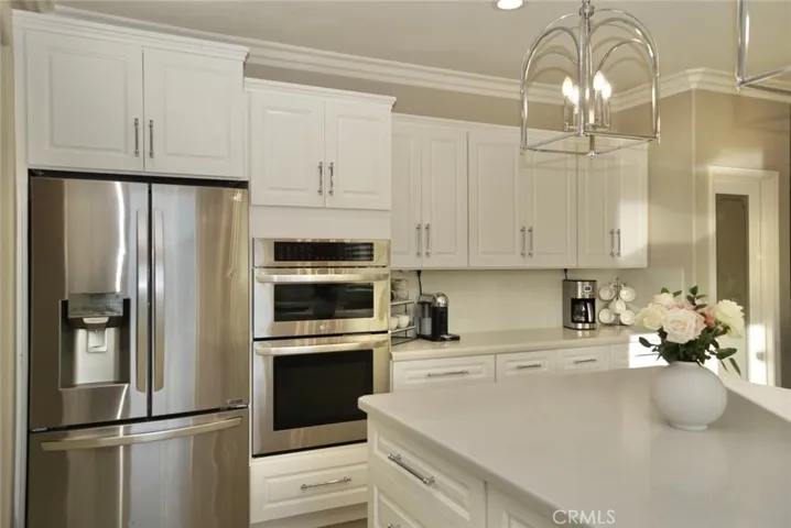 STAINLESS STEEL APPLIANCES, UPDATED CABINETRY, PLENTY OF STORAGE W/BUILT IN APPLIANCES