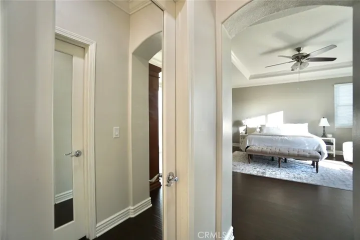 HIS/HERS WALK IN CLOSETS WITH MIRROR DOORS