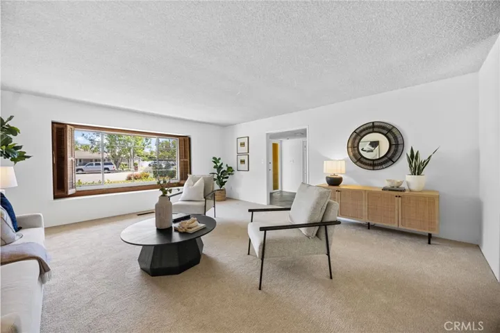 Large windows bring in natural light and create a warm, inviting atmosphere