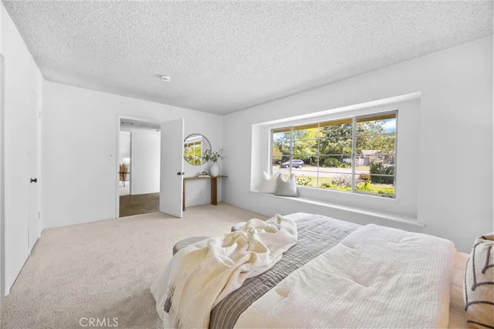 A generously sized main-floor ensuite offers comfort and flexibility, complete with a large walk-in closet.