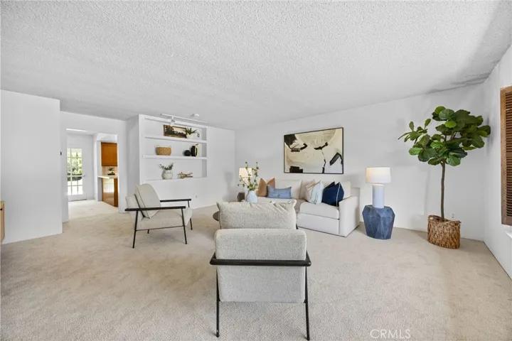 Spacious living room with bright sunshine and endless design potential.