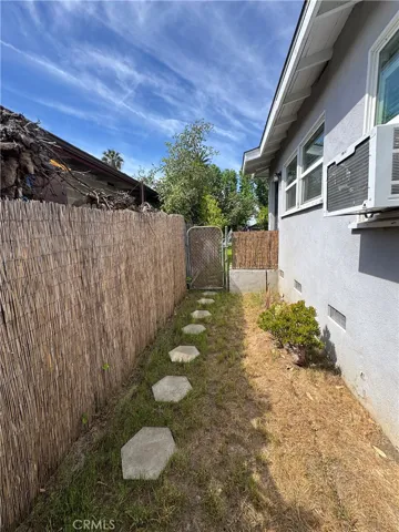 Side yard looking from back of the house to the front