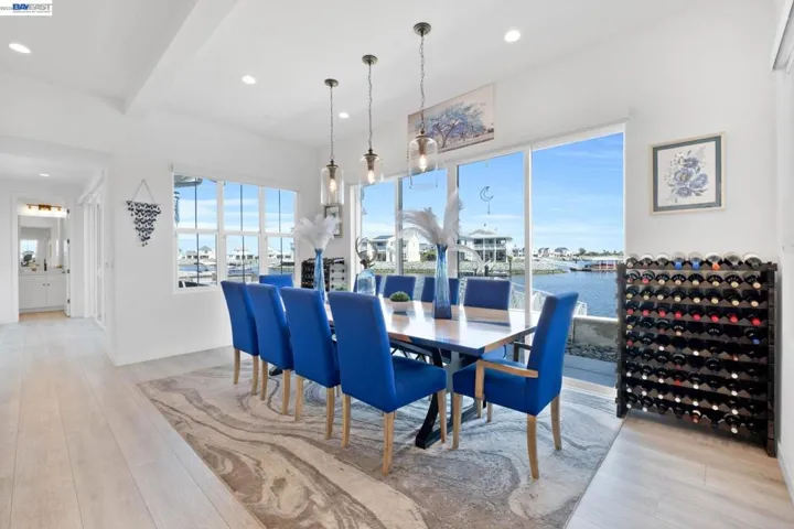SPACIOUS DINING ROOM AREA WITH PENDANT LIGHTING