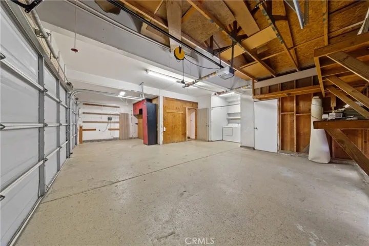 Large 3-Car Garage With High Ceilings And Ample Storage Space