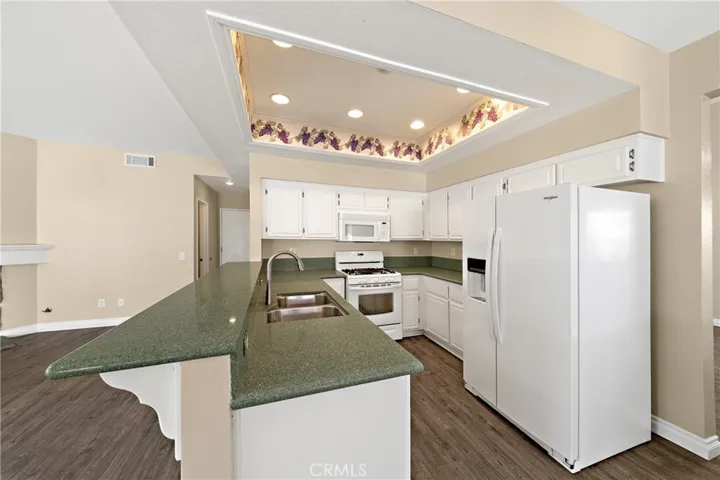 Functional Kitchen Layout With Plenty Of Cabinetry And Natural Light