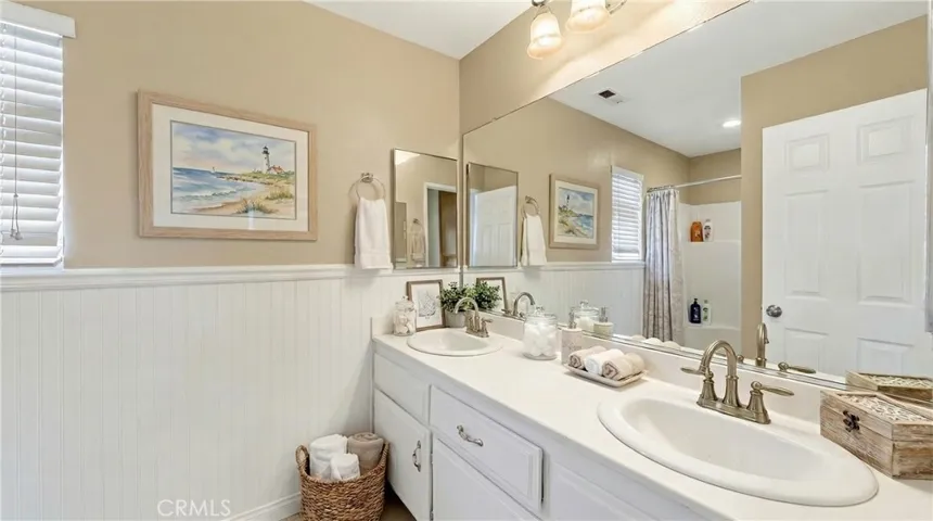 Bathroom With Dual Sinks And Updated Fixtures - Digitally Staged