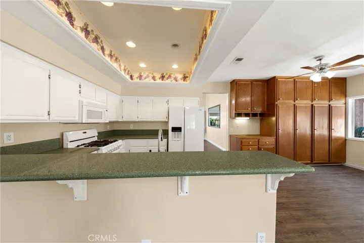 Open Kitchen With Breakfast Bar Seating And Ample Counter Space