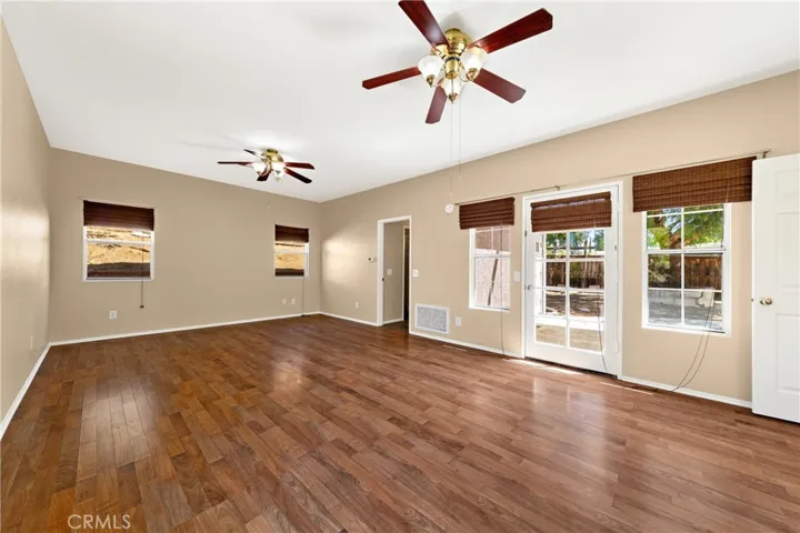 Downstairs Primary Bedroom With Ample Natural Light And Outdoor Access