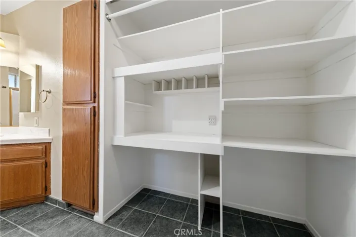 Closet With Built-In Shelving And Organized Storage