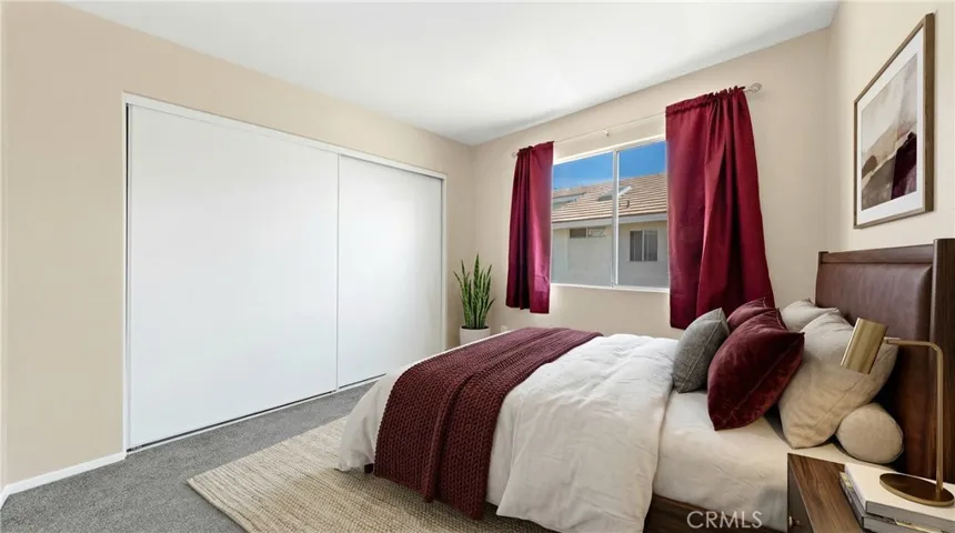 Upstairs Bedroom With Window, Natural Light, And Closet Space - Digitally Staged