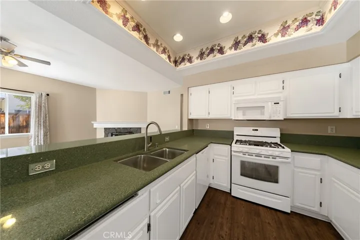 Bright Kitchen With Recessed Lighting And Generous Countertops