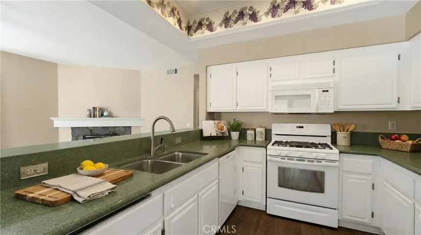 Bright Kitchen With Recessed Lighting And Generous Countertops - Digitally Staged