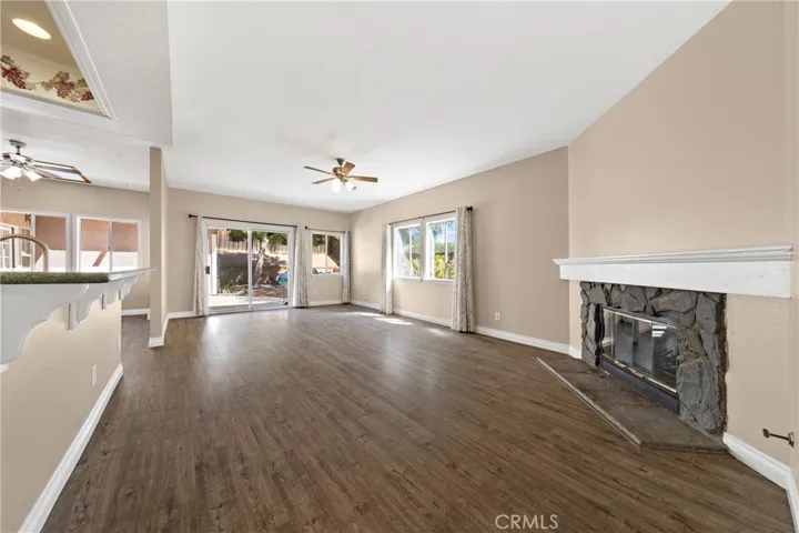 Spacious Family Room With Fireplace And Open Sightlines To Kitchen