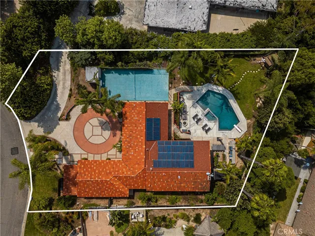 This aerial view shows the approximate lot lines. In 2013 the majority of the tile roof was reworked and the backside of the roof that holds the solar equipment had new composition shingles installed with matching color. The solar system installation in 2014 services the house only.