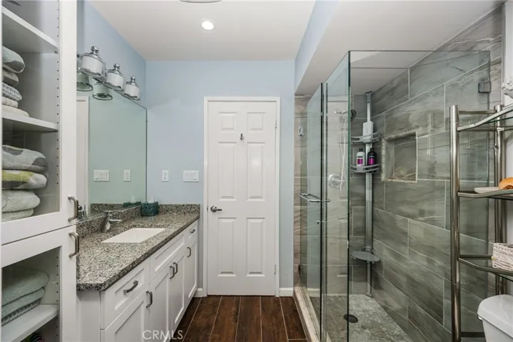 Gorgeously remodeled, this 3/4 bath off the lower-level bedroom is far away from all the upper level bedrooms.
