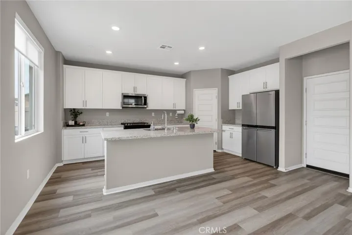 Full Kitchen - Garage door entry at right side- Pantry in back corner