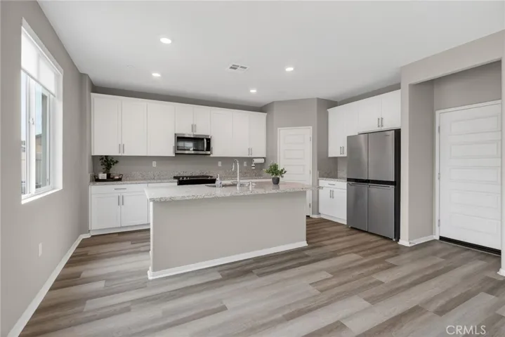 Full Kitchen - Garage door entry at right side- Pantry in back corner