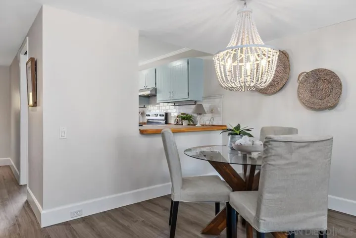 Freshi paint, luxury vinyl plank flooring, brand new decorative chandlier, loads of natural light and direct access to back patio area.
