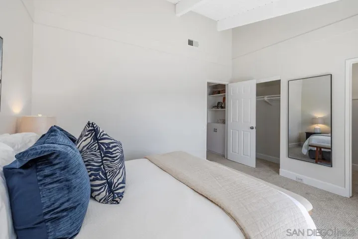 Brand new carpet, vaulted wood beamed ceiling, freshly painted, sliding glass door to balcony, walk-in closet and additional traditional closet.