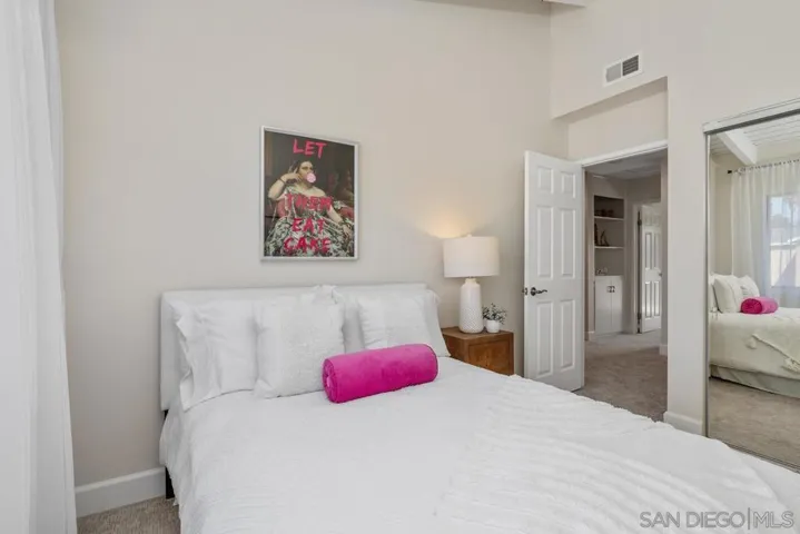Brand new carpet, vaulted wood beamed ceiling, freshly painted, mirrored closet doors and loads of light.