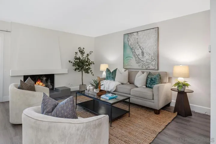 Freshi paint, luxury vinyl plank flooring, fireplace, loads of natural light and direct access to back patio area.