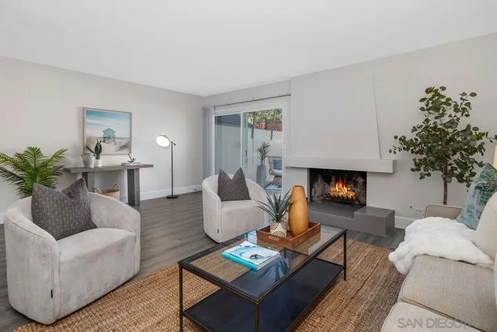 Freshi paint, luxury vinyl plank flooring, fireplace, loads of natural light and direct access to back patio area.