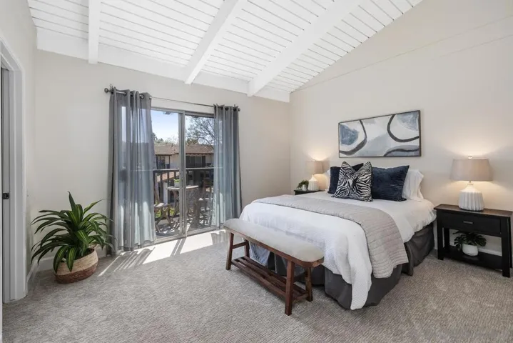Brand new carpet, vaulted wood beamed ceiling, freshly painted, sliding glass door to balcony, walk-in closet and additional traditional closet.