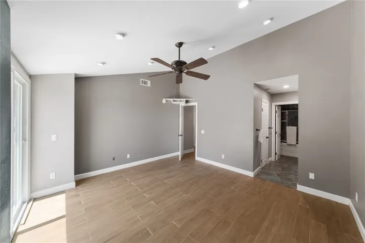 Primary suite offers a generous layout with en suite bath access, modern finishes, and seamless indoor-outdoor connection.