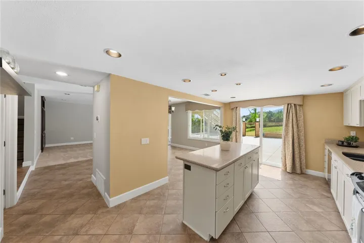 Open kitchen design flows easily into the dining and living areas, enhancing everyday functionality and entertaining potential.