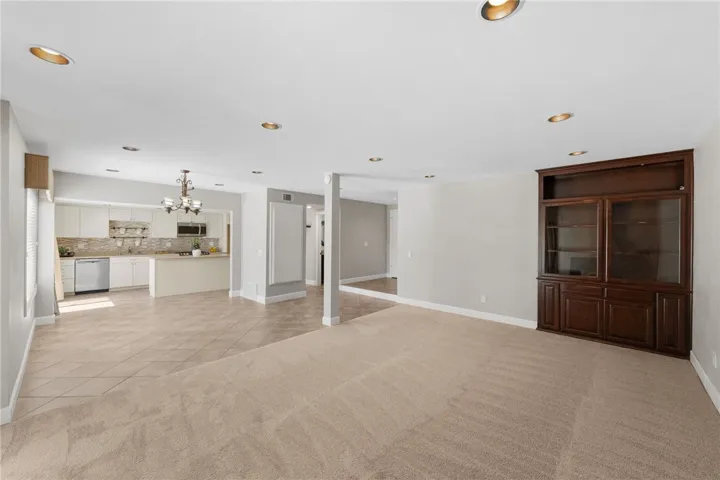 Main living space includes custom built-in cabinetry, recessed lighting, and an open layout that enhances both function and flexibility.