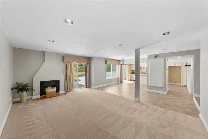 Expansive living area connects easily to the kitchen and dining spaces, offering a comfortable setting for daily living and entertaining.