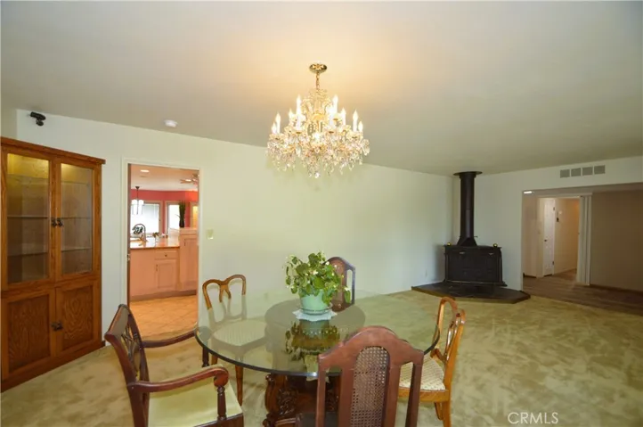 Dining area & living room with wood burning stove