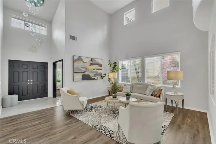 View of entrance with chandelier and living room
