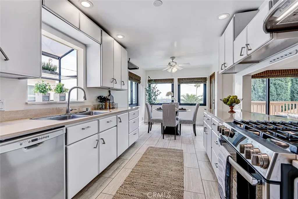 kitchen with newer quartz countertops - view to the breakfast area