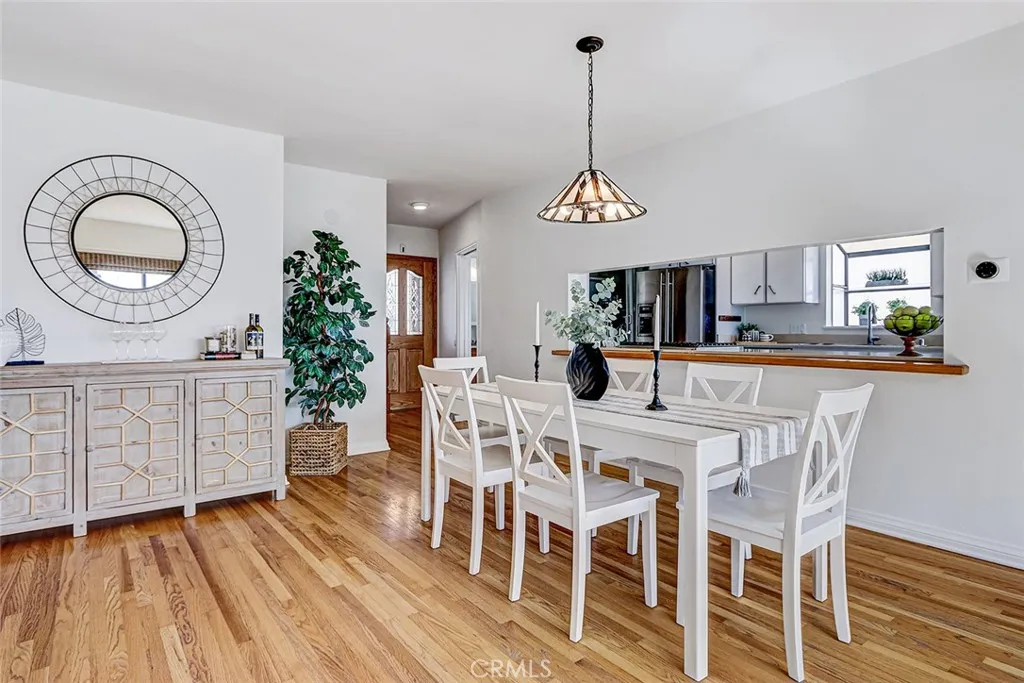 Open concept view of dining area, main entrance and the kitchen
