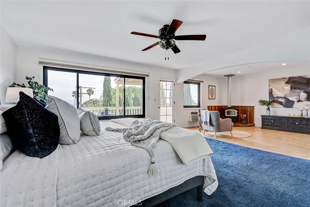 Main bedroom on second floor has balcony and seating area