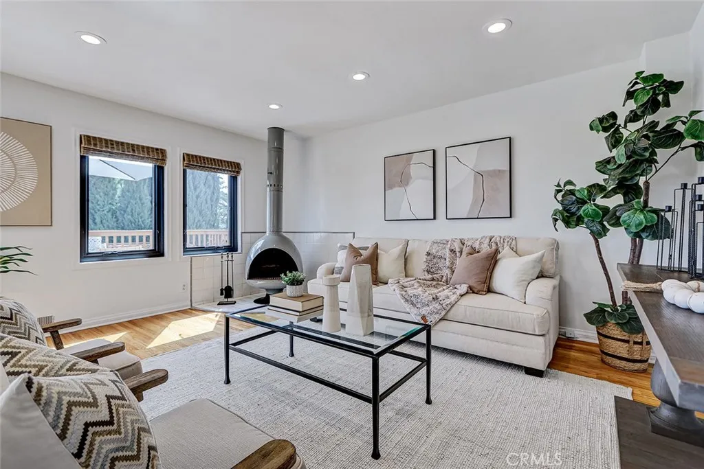 Living area with stand alone woodburning fireplace