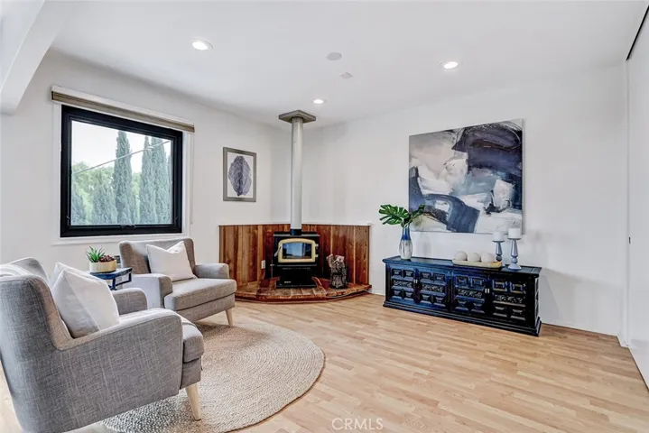 Seating area with small stand alone wood burning fireplace