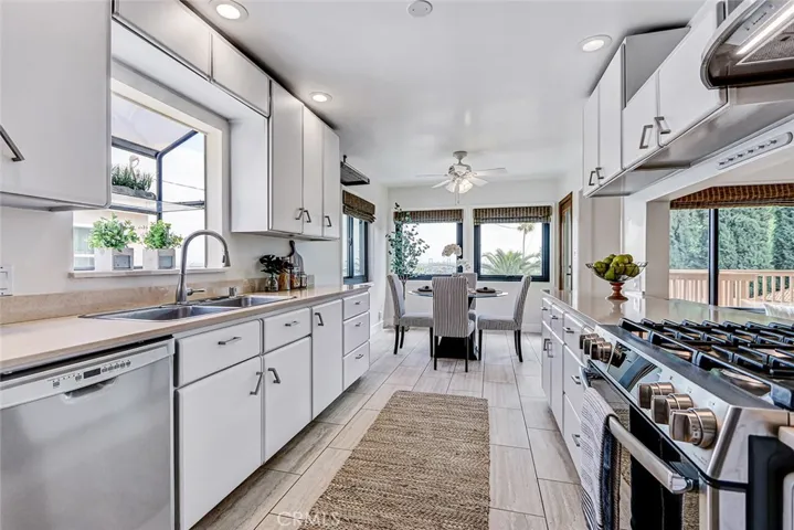 kitchen with newer quartz countertops - view to the breakfast area
