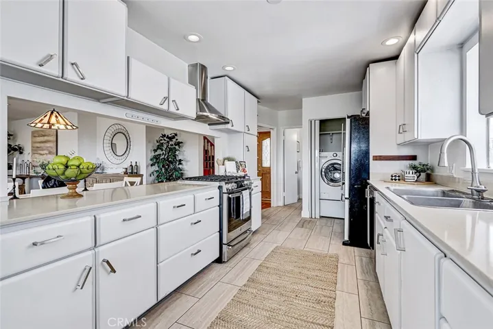 Kitchen view showing laundry closet