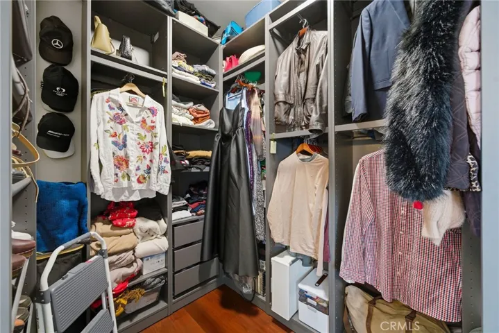 Walk-in closet with built-ins for organized storage.